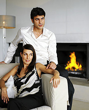 Couple sitting by fire image