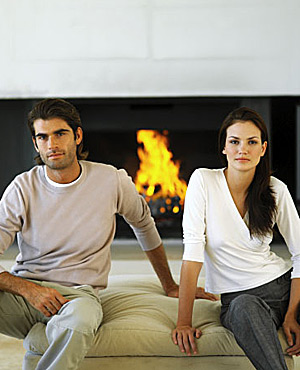 Couple sitting by fire image